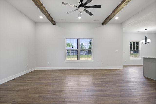 spare room featuring dark wood-type flooring, beamed ceiling, baseboards, and ceiling fan with notable chandelier