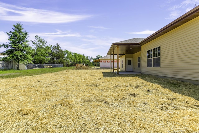 view of yard featuring a patio area and fence