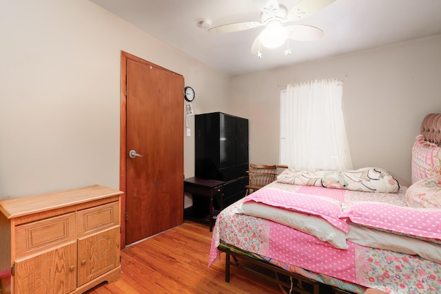 bedroom featuring ceiling fan and light wood-style flooring