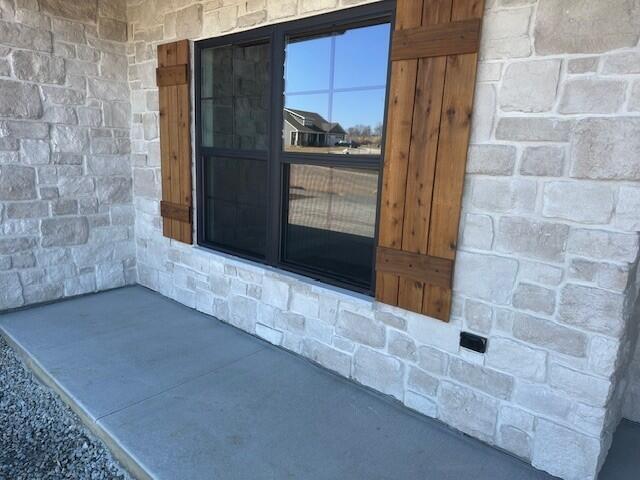 view of exterior entry with stone siding