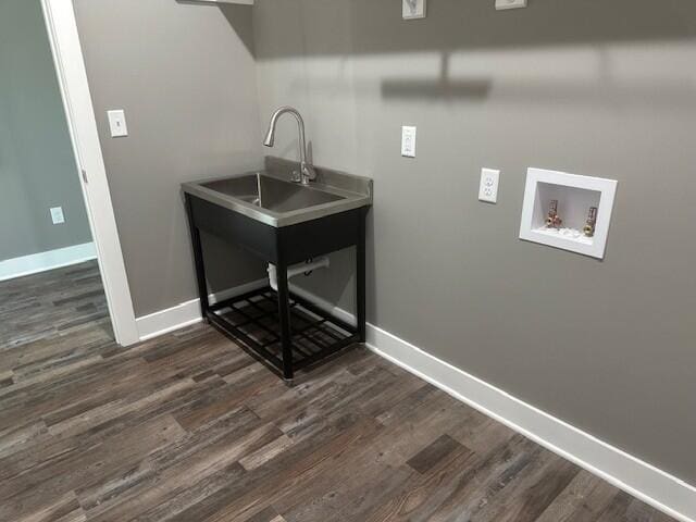 laundry area featuring laundry area, dark wood-type flooring, washer hookup, and baseboards