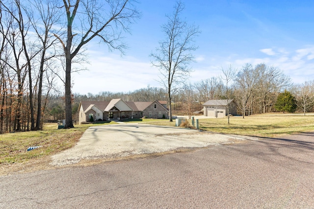 view of street featuring aphalt driveway