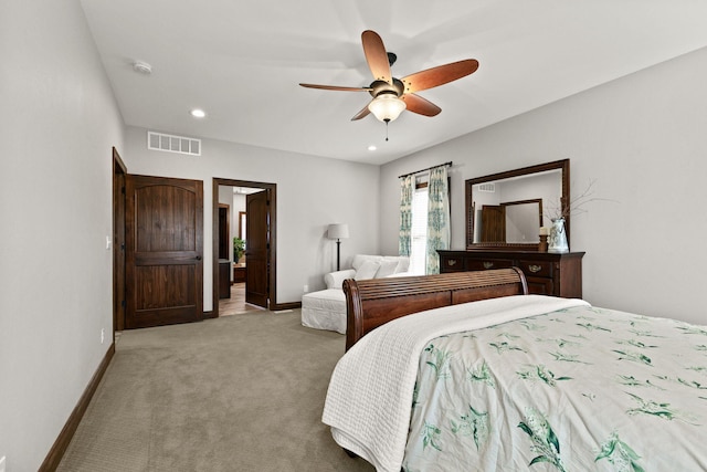 bedroom with recessed lighting, visible vents, light colored carpet, and baseboards