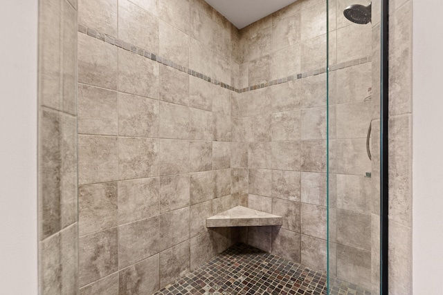 full bathroom with a tile shower