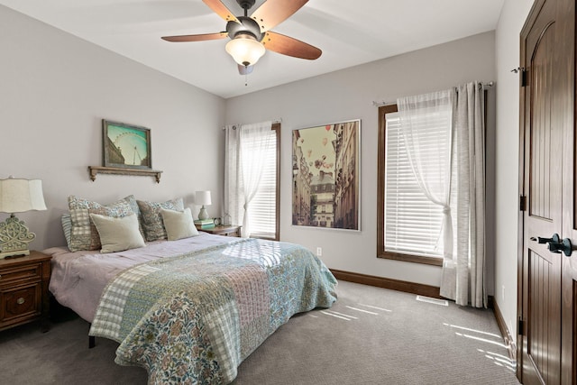 bedroom featuring visible vents, baseboards, carpet, and ceiling fan