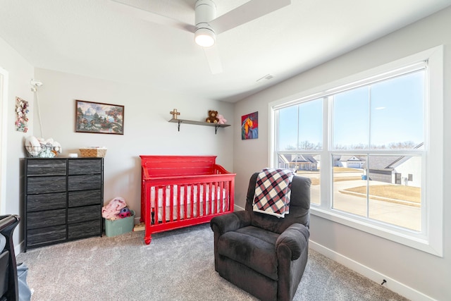 carpeted bedroom featuring visible vents, ceiling fan, and baseboards