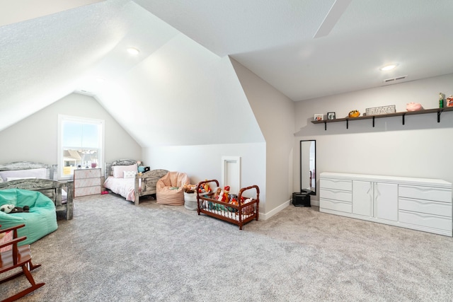 bedroom with carpet flooring, vaulted ceiling, visible vents, and baseboards