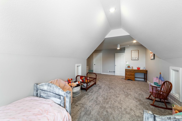 bedroom featuring carpet floors, lofted ceiling, visible vents, a textured ceiling, and baseboards