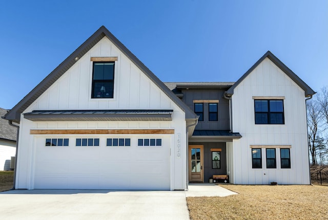 modern inspired farmhouse with driveway, a garage, metal roof, a standing seam roof, and board and batten siding