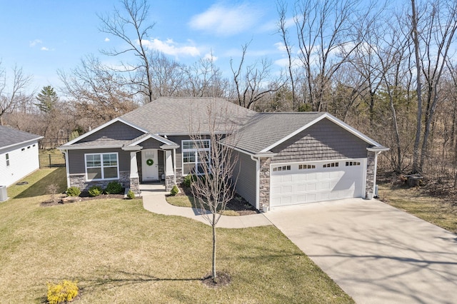 view of front of house with stone siding, an attached garage, concrete driveway, and a front lawn