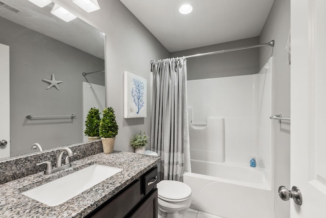 full bathroom with tile patterned floors, visible vents, shower / bath combo with shower curtain, toilet, and vanity