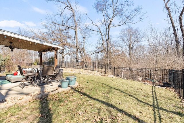 view of yard with ceiling fan, a patio, and a fenced backyard