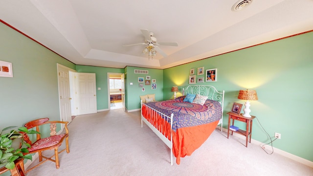 bedroom with visible vents, a raised ceiling, baseboards, ceiling fan, and carpet