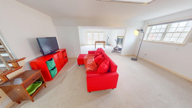 playroom with plenty of natural light, carpet, and baseboards