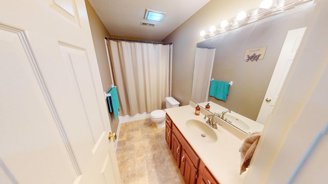 bathroom with visible vents, a shower with shower curtain, toilet, a textured ceiling, and vanity