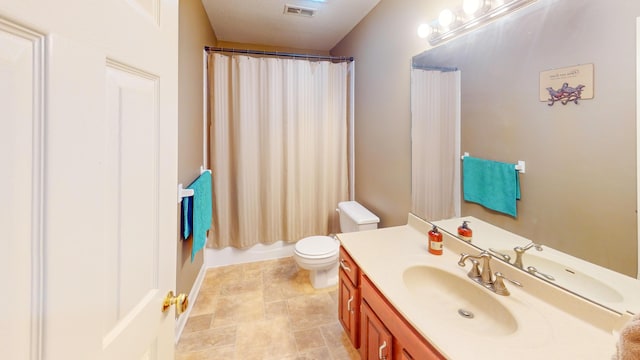 bathroom with toilet, curtained shower, visible vents, and vanity