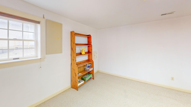 unfurnished room featuring carpet floors, baseboards, and visible vents