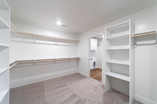 walk in closet with carpet and visible vents