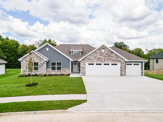 craftsman house featuring driveway, a garage, a shingled roof, board and batten siding, and a front yard