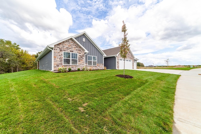 view of front facade featuring board and batten siding, a front yard, concrete driveway, and an attached garage