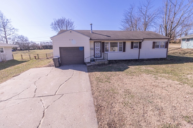 ranch-style house with a front lawn, fence, concrete driveway, an attached garage, and a shingled roof