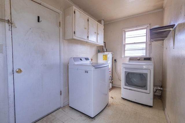 washroom featuring gas water heater, cabinet space, light floors, and washing machine and dryer