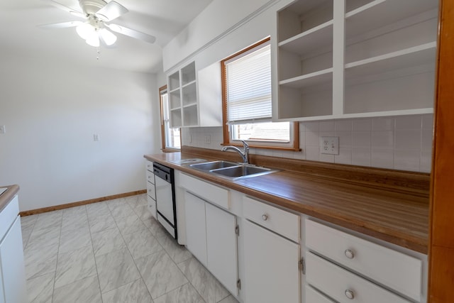 kitchen with open shelves, marble finish floor, white dishwasher, and a sink