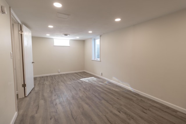 basement with recessed lighting, baseboards, and wood finished floors