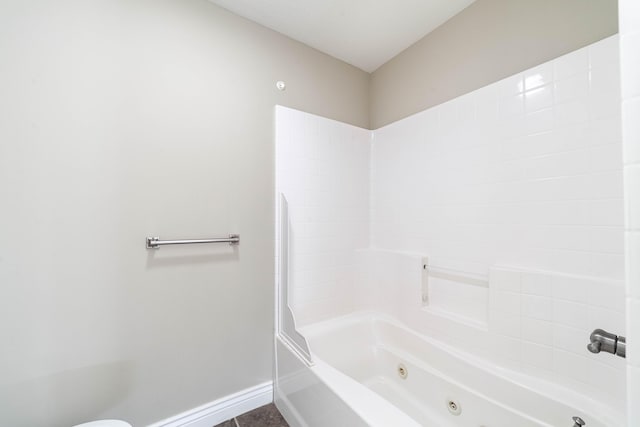 full bath with tile patterned floors, a combined bath / shower with jetted tub, and baseboards