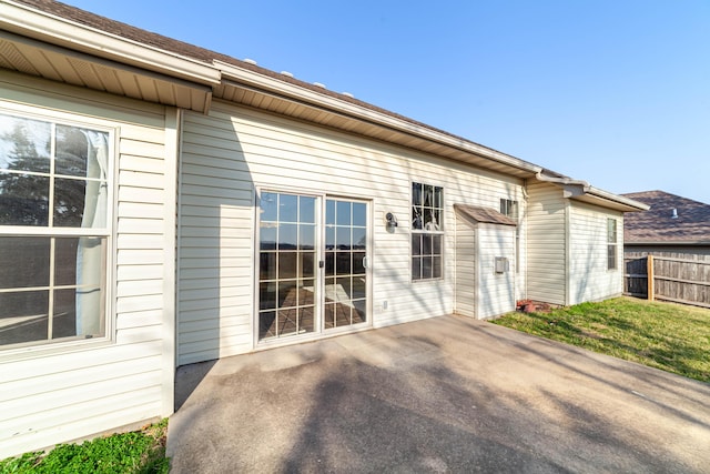 back of house featuring a patio and fence