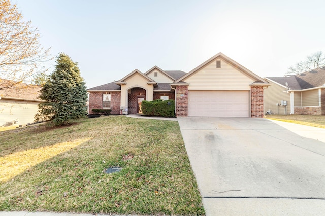 view of front of house with a front lawn, an attached garage, brick siding, and driveway