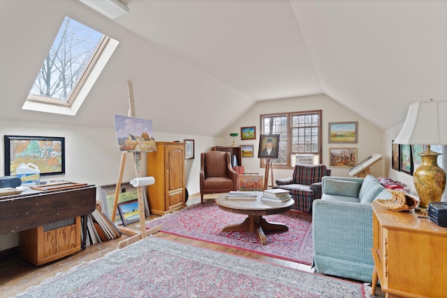 living room featuring vaulted ceiling with skylight and wood finished floors