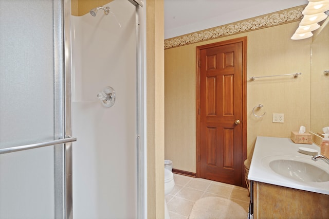 full bath featuring tile patterned flooring, a shower stall, toilet, and vanity