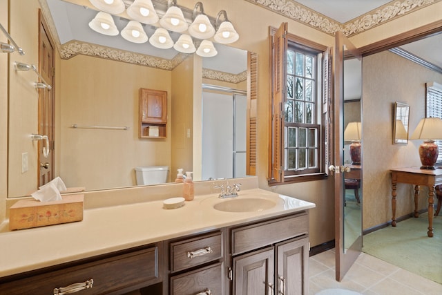 bathroom featuring vanity, baseboards, a shower stall, tile patterned floors, and toilet