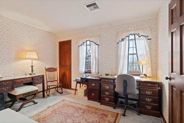 home office featuring visible vents, carpet, and wallpapered walls