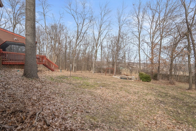 view of yard featuring stairs and a deck