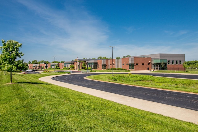 view of home's community with a lawn