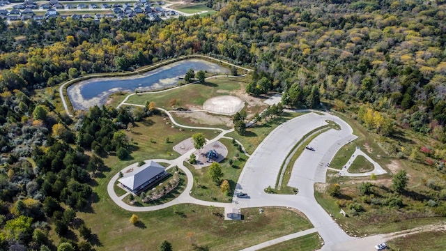 birds eye view of property with a wooded view