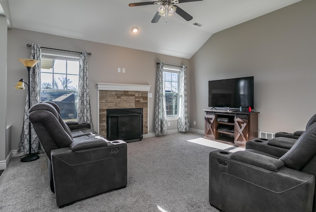 living room with visible vents, carpet floors, baseboards, lofted ceiling, and a fireplace