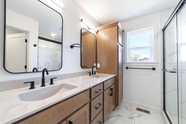 full bath with a sink, visible vents, a marble finish shower, and marble finish floor