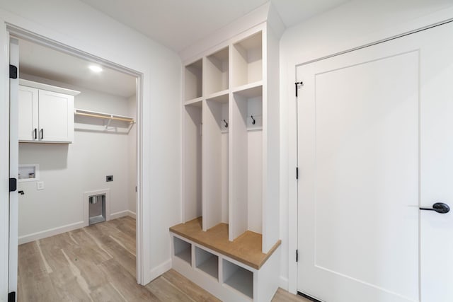 mudroom with baseboards and light wood finished floors