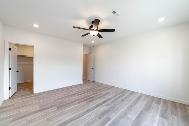 unfurnished bedroom featuring visible vents, recessed lighting, light wood-style floors, baseboards, and ceiling fan