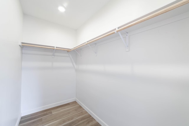 spacious closet with wood finished floors