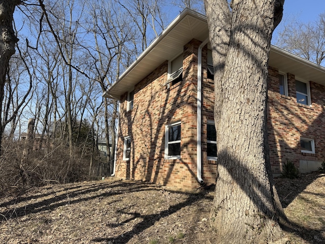 view of side of property with brick siding