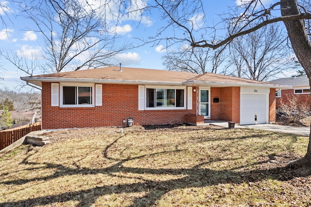 ranch-style home with driveway, fence, a front yard, a garage, and brick siding