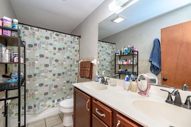 bathroom with a sink, tile walls, and tile patterned flooring