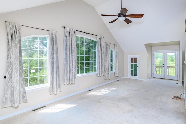 unfurnished sunroom featuring visible vents, french doors, a ceiling fan, and vaulted ceiling