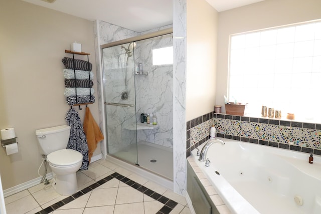 full bathroom featuring toilet, a jetted tub, a marble finish shower, tile patterned flooring, and baseboards