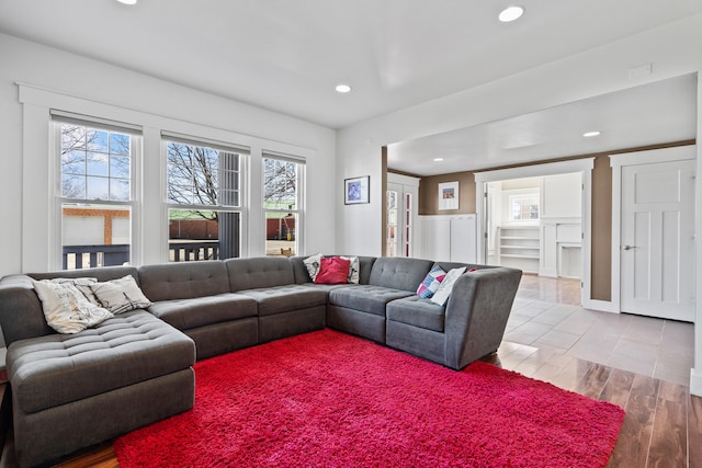 living room featuring light wood-style flooring and recessed lighting