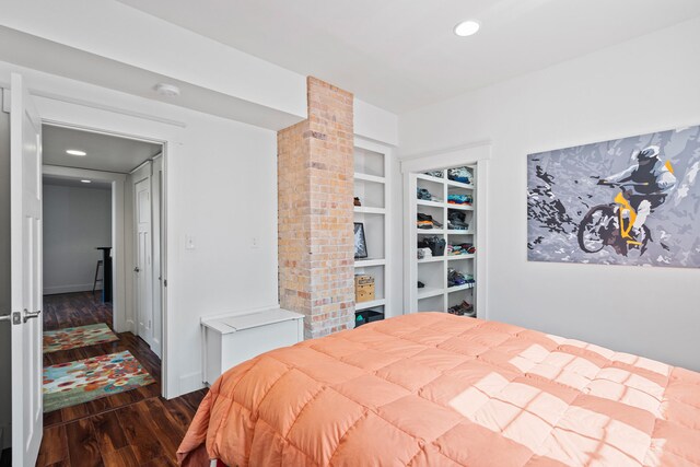 bedroom featuring dark wood-type flooring, recessed lighting, and baseboards